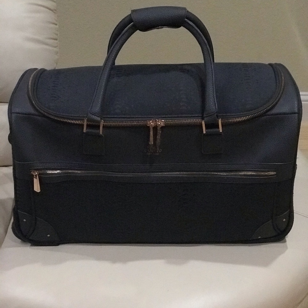 Vince Camuto Traveler